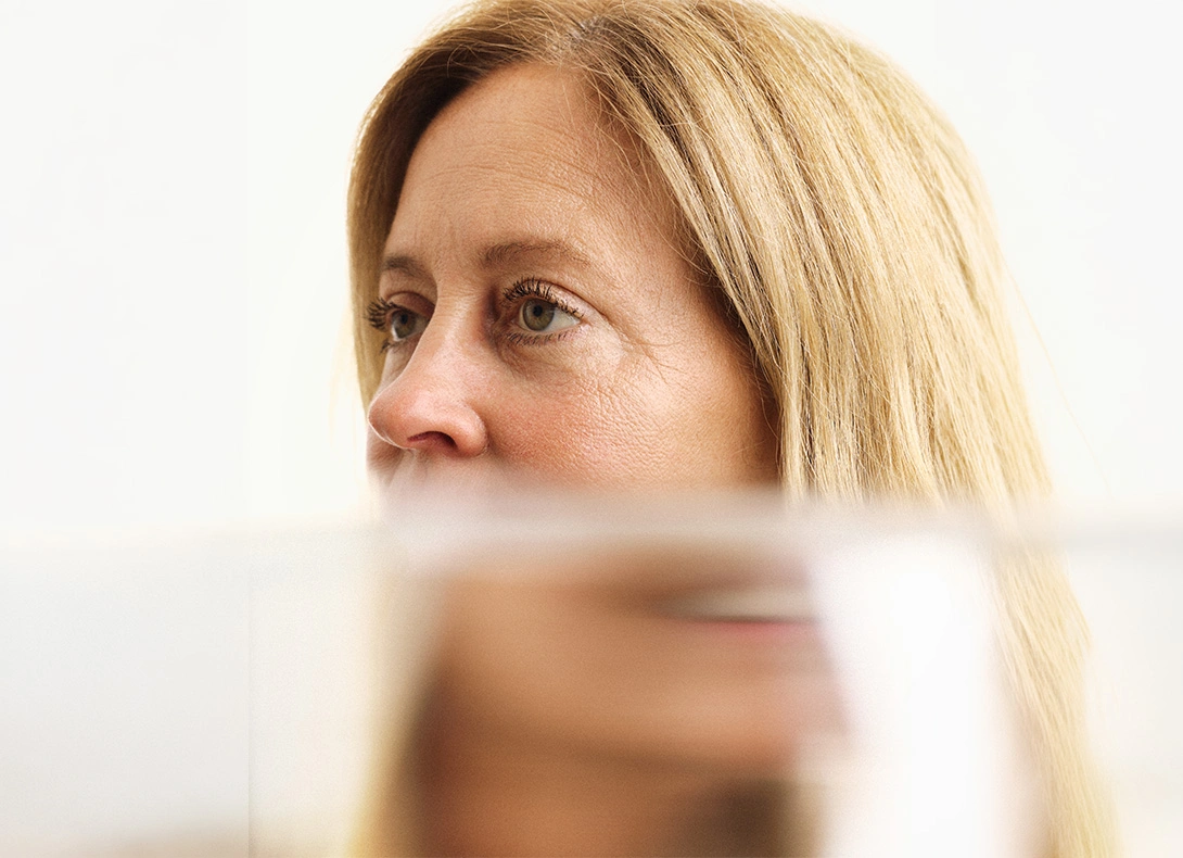 Woman looking thoughtfully to the side with blonde hair in soft natural lighting. - C02 Laser skin resurfacing in Montreal, QC