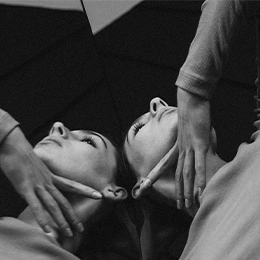 Patient receiving facial massage treatment during brow lift consultation or procedure in clinical setting - Neck lift in Montreal, QC