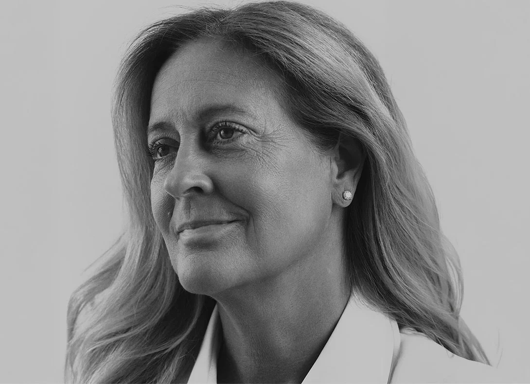 Professional woman with smooth facial features smiling, demonstrating natural-looking cosmetic enhancement results - Liquid facelift in Montreal, QC